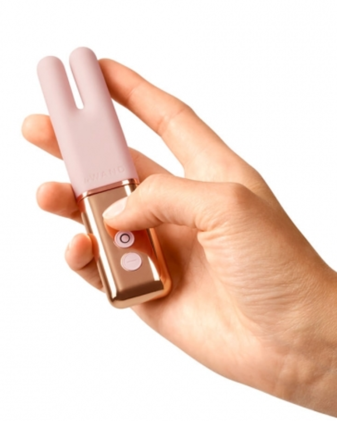 Le Wand Deux Twin Motor Rechargeable Waterproof Vibrator - Rose Gold held in a hand