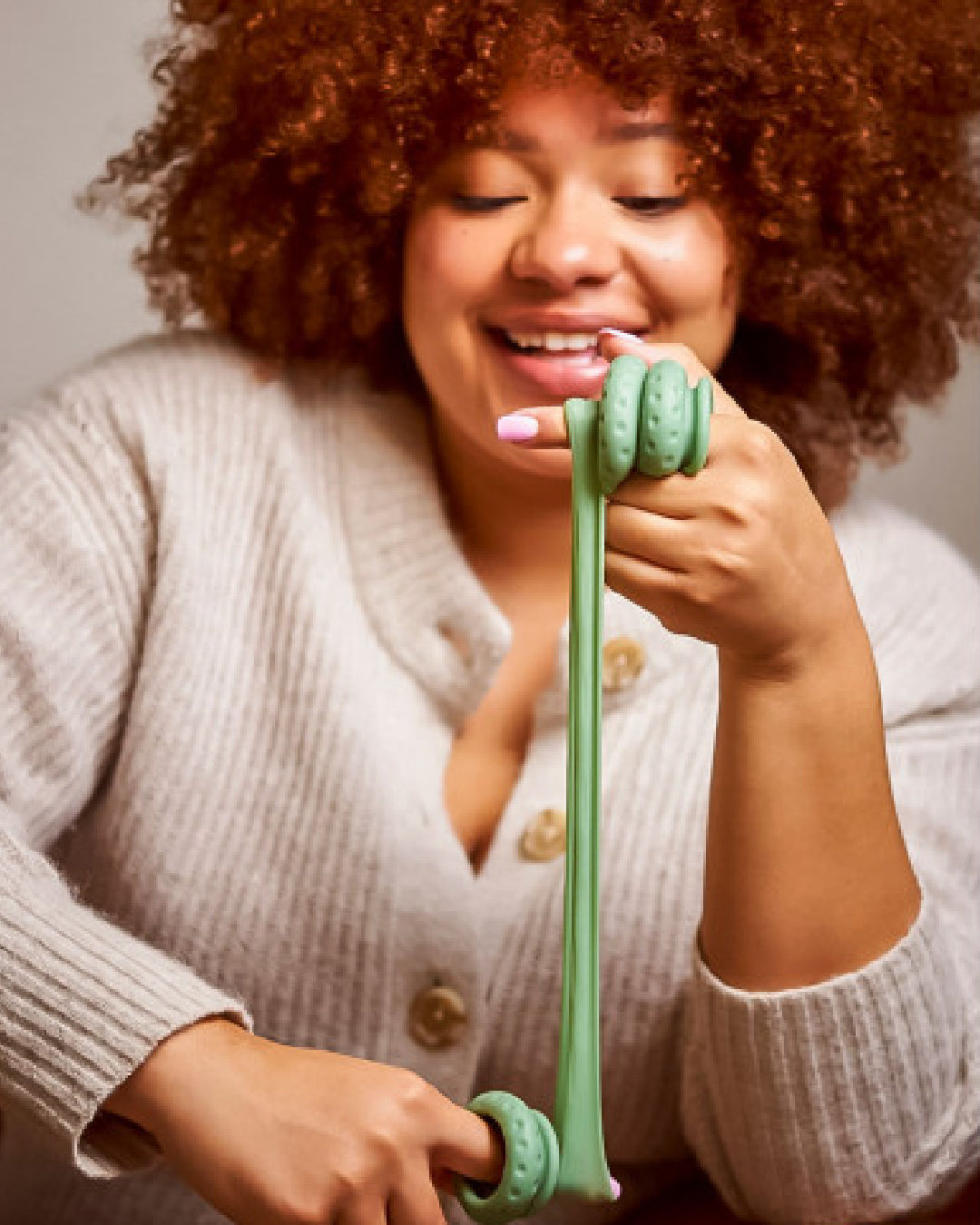 Ohnut Wide Set of 4 Wearable Penetration Adjustment Rings being stretched out by model