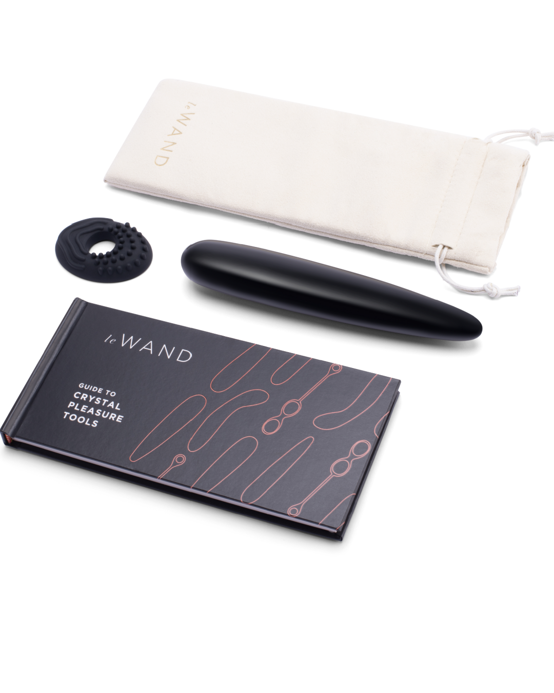 Le Wand Crystal Slim Wand - Black Obsidian next to storage pouch, silicone ring and manual