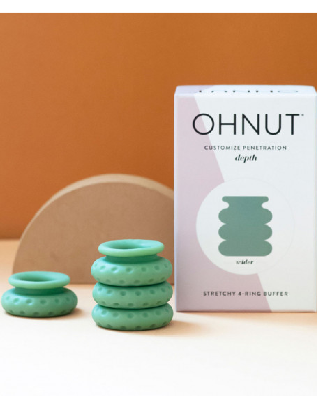 Ohnut Wide Set of 4 Wearable Penetration Adjustment Rings rings and box with orange background