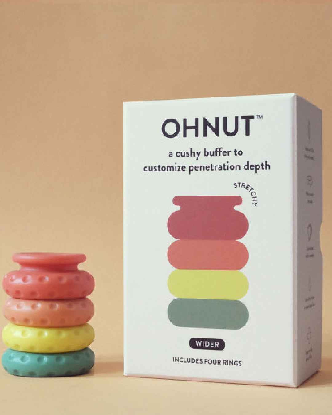 Ohnut Wide Set of 4 Wearable Penetration Adjustment Rings -Rainbow colored rings next to white product box on beige background