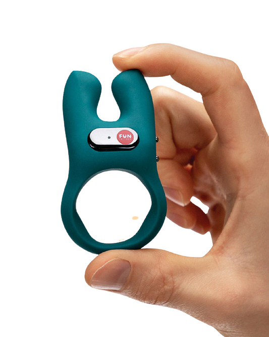 Fun Factory NŌS Vibrating Couples Penis Ring - Blue HELD IN A PERSON'S HAND ON A white BACKGROUND