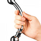 Le Wand Bow Double Ended Stainless Steel Dildo held at the center by a person's hand to illustrate the size of the dildo