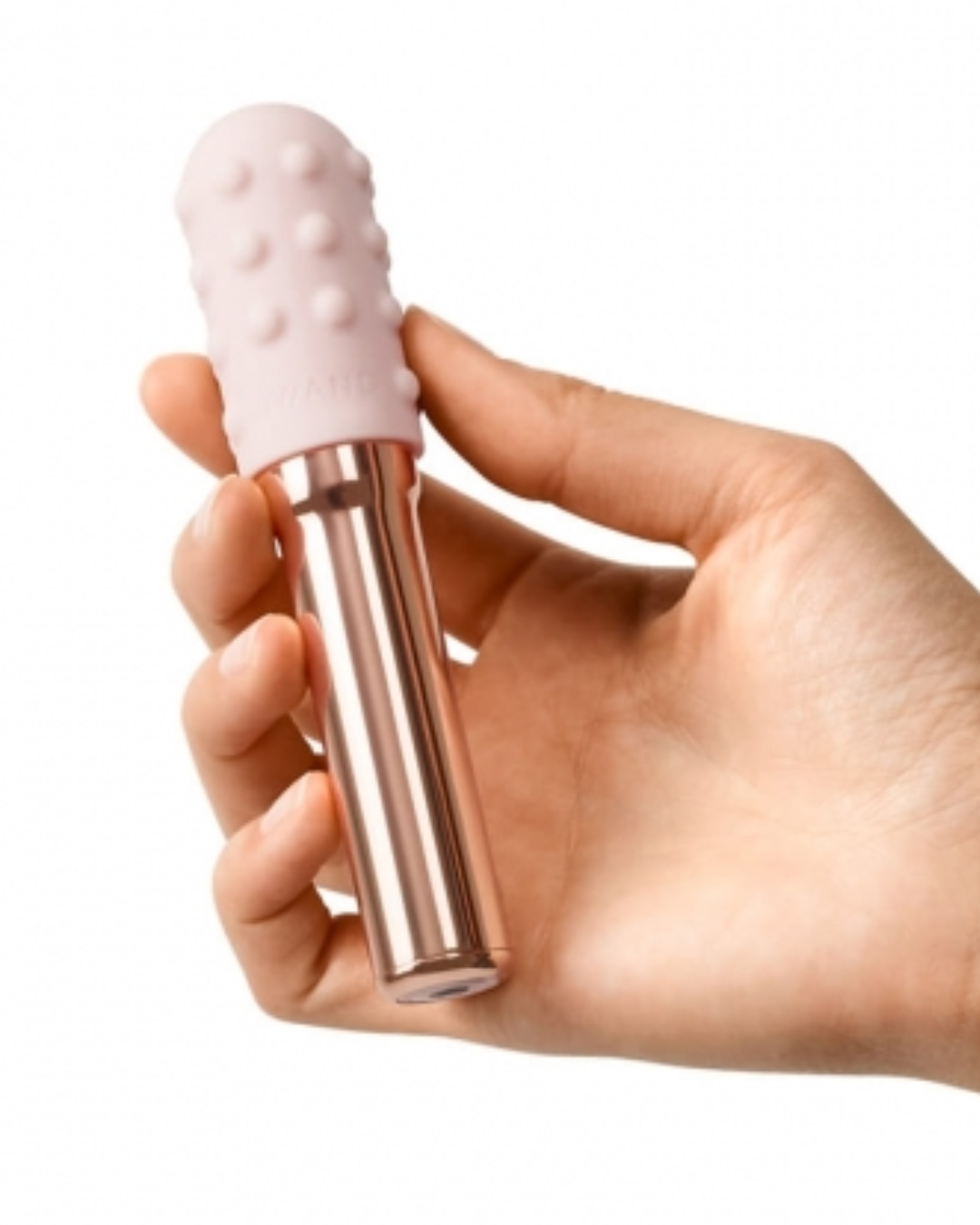 Le Wand Chrome Grand Bullet Waterproof Rechargeable Metal Bullet with Texture Sleeve - Rose Gold held in a hand