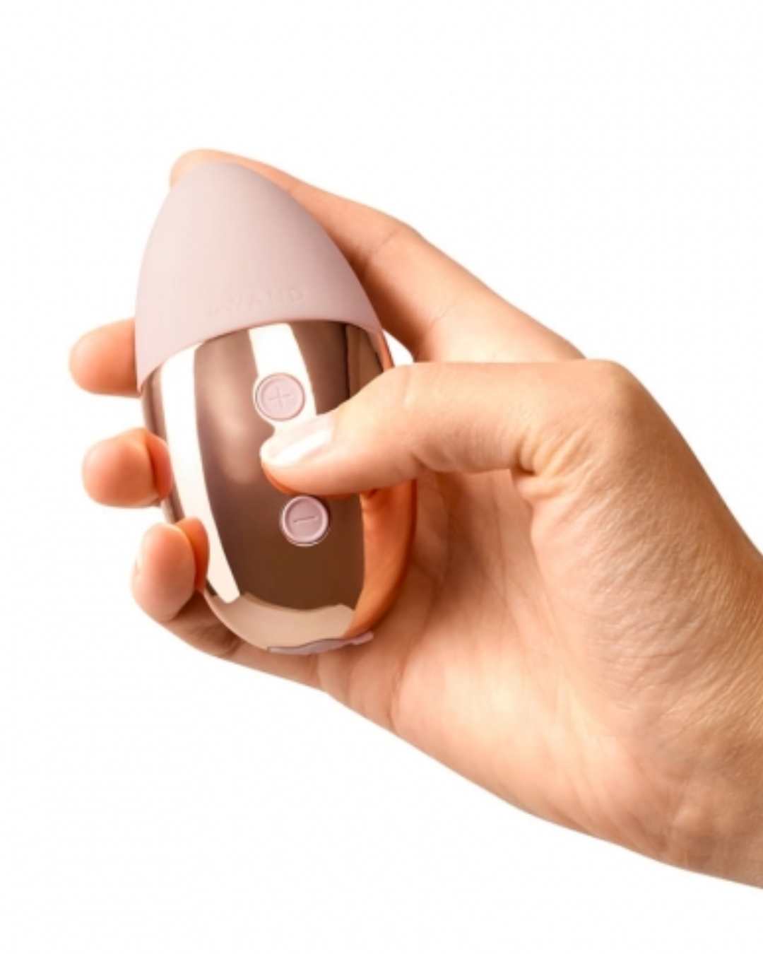 Le Wand Point Weighted Waterproof Silicone Lay-On Vibrator - Rose Gold held in a hand