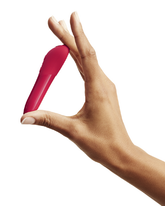 We-Vibe Tango X Powerful Bullet Vibrator - Cherry Red held in a woman's hand