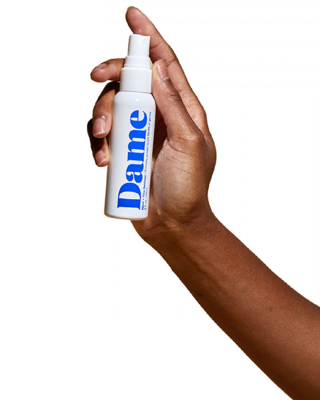 Dame Hand and Toy Cleaner white bottle with blue writing held in model's hand 
