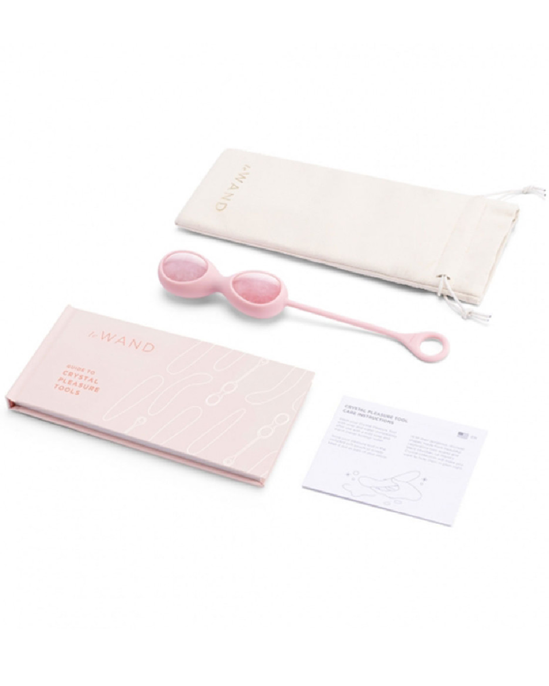 Le Wand Crystal Yoni Eggs - Rose Quartz in silicone case with loop handle next to storage bag and instruction booklet 