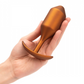 B-vibe Snug Plug 4 XL Weighted Silicone Butt Plug (257 grams) - Sunburst Orange held in a hand
