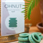 Ohnut Wide Set of 4 Wearable Penetration Adjustment Rings and box with plant in background 